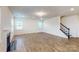 Bright living room with a staircase and lots of space for entertaining Gathering and friends at 8286 Ashvale Nw St, Concord, NC 28027