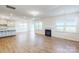 Spacious living room boasts hardwood floors, recessed lighting, and a cozy fireplace at 8286 Ashvale Nw St, Concord, NC 28027