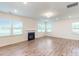 Welcoming living room featuring large windows, fireplace, and recessed lighting at 8286 Ashvale Nw St, Concord, NC 28027