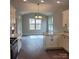 Bright kitchen featuring white cabinets, granite countertops, and modern appliances at 835 A Wynnshire Dr # 53, Hickory, NC 28601