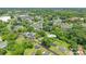 An aerial view of a neighborhood displaying cozy homes and mature tree coverage at 917 Laye St, Belmont, NC 28012
