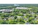An aerial view of a neighborhood with nearby lake and commercial properties at 917 Laye St, Belmont, NC 28012