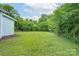 Expansive backyard with mature trees, providing a private and tranquil setting at 917 Laye St, Belmont, NC 28012