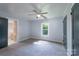 Cozy bedroom with plush carpet, a ceiling fan, and lots of natural light at 917 Laye St, Belmont, NC 28012