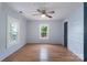 Bright and airy bedroom with hardwood floors, neutral walls, and a ceiling fan at 917 Laye St, Belmont, NC 28012