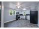 Modern kitchen with stainless steel appliances, white cabinets, and tiled backsplash at 917 Laye St, Belmont, NC 28012