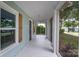 Inviting screened-in porch with white floors and plenty of natural light at 917 Laye St, Belmont, NC 28012