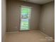 Bedroom with view to the exterior via a window with blinds at 9207 Branson Ct, Charlotte, NC 28210
