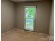 Empty bedroom with large window and blinds at 9207 Branson Ct, Charlotte, NC 28210