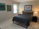 Comfortable bedroom featuring stylish furnishings and natural light from the window at 9207 Branson Ct, Charlotte, NC 28210