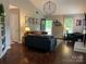 Comfortable living room featuring hardwood floors, stylish furnishings, and a cozy atmosphere. Perfect for relaxing or entertaining at 9207 Branson Ct, Charlotte, NC 28210