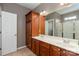 Bathroom featuring a double sink vanity with wood cabinets and a stand up shower at 100 Oakwood Meadow Dr, Mooresville, NC 28115