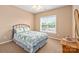 Bedroom with natural light, window, ceiling fan, and carpet flooring at 100 Oakwood Meadow Dr, Mooresville, NC 28115