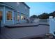 A large deck with an outdoor dining area offers an inviting space for gatherings and relaxation at 100 Oakwood Meadow Dr, Mooresville, NC 28115