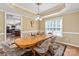 Bright dining room showcasing a wood table and chairs with a window providing natural light at 100 Oakwood Meadow Dr, Mooresville, NC 28115
