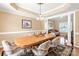 View of the dining room featuring a wood table with seating for six and an elegant chandelier at 100 Oakwood Meadow Dr, Mooresville, NC 28115