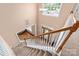 View from the top of the staircase to the foyer, showcasing the entrance and layout at 100 Oakwood Meadow Dr, Mooresville, NC 28115