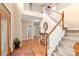Grand foyer showcasing a staircase with wood and white railings, with views to other rooms at 100 Oakwood Meadow Dr, Mooresville, NC 28115