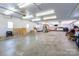 Large garage with painted walls and concrete flooring providing storage solutions and workspace at 100 Oakwood Meadow Dr, Mooresville, NC 28115