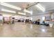 Spacious garage features ample lighting, lots of storage, and epoxy-sealed concrete flooring at 100 Oakwood Meadow Dr, Mooresville, NC 28115