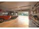 Garage features ample lighting, storage, and space for two cars and leads to backyard at 100 Oakwood Meadow Dr, Mooresville, NC 28115