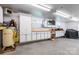 Large garage featuring cabinets, work area, and an air compressor at 100 Oakwood Meadow Dr, Mooresville, NC 28115