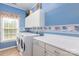 Laundry room with washer, dryer, utility sink, and cabinets at 100 Oakwood Meadow Dr, Mooresville, NC 28115