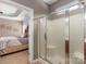 Frosted glass shower with chrome frame and a view into a bedroom at 100 Oakwood Meadow Dr, Mooresville, NC 28115