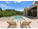 Inviting outdoor pool and patio area with lounge chairs for relaxing and entertaining at 10201 Laurier Ln, Huntersville, NC 28078