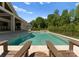 Beautiful backyard featuring a sparkling swimming pool, comfortable lounge chairs, and a serene outdoor setting at 10201 Laurier Ln, Huntersville, NC 28078