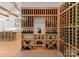 Spacious wine cellar featuring custom wooden racks, perfect for showcasing a wine collection at 10201 Laurier Ln, Huntersville, NC 28078