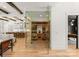 Walk-in wine cellar featuring glass doors and wooden racks for extensive wine storage at 10201 Laurier Ln, Huntersville, NC 28078