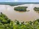 Breathtaking aerial view showcases a lake with forestry and waterfront homes at 1077 Jackson Rd, Fort Lawn, SC 29714