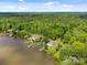 Expansive aerial view of stunning waterfront homes surrounded by lush forestry and picturesque lake at 1077 Jackson Rd, Fort Lawn, SC 29714