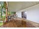 Covered porch with table and chairs, a hammock, and view of the lake at 1077 Jackson Rd, Fort Lawn, SC 29714