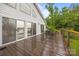 Back deck with sliding glass doors, outdoor seating, and lake views at 1077 Jackson Rd, Fort Lawn, SC 29714