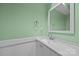 Bright bathroom features a modern sink with a minimalist mirror and refreshing light green walls at 1077 Jackson Rd, Fort Lawn, SC 29714