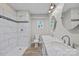 Modern bathroom with tiled walk-in shower, double vanity with marble countertop, and stylish fixtures at 1077 Jackson Rd, Fort Lawn, SC 29714