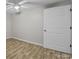 A simple bedroom with hardwood floors, a ceiling fan, and a closet at 1077 Jackson Rd, Fort Lawn, SC 29714