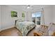 Cozy bedroom with queen bed, ceiling fan, and sliding glass door to outdoor area at 1077 Jackson Rd, Fort Lawn, SC 29714