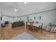 Open-concept living and dining room with high ceilings, lots of natural light and wood flooring at 1077 Jackson Rd, Fort Lawn, SC 29714