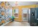 Dining area with floral wallpaper, stainless steel refrigerator, and window at 1162 Willet Dr, Rock Hill, SC 29732