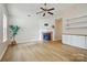 Bright living room featuring a fireplace, stylish shelving, and new flooring at 1162 Willet Dr, Rock Hill, SC 29732