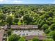 Overhead aerial view of the community with lush trees and parking at 1228 Archdale Dr # H, Charlotte, NC 28217