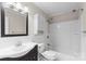 Well-lit bathroom features a shower over tub and a vanity with storage at 1228 Archdale Dr # H, Charlotte, NC 28217