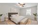 The bedroom features a bed and neutral tones for a cozy feel at 1228 Archdale Dr # H, Charlotte, NC 28217