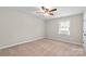 An empty bedroom with carpet at 1228 Archdale Dr # H, Charlotte, NC 28217