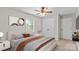 Cozy bedroom with ceiling fan, neutral colors, and natural light at 1228 Archdale Dr # H, Charlotte, NC 28217
