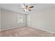 An empty bedroom with a window at 1228 Archdale Dr # H, Charlotte, NC 28217