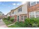 A row of townhouses featuring brick and siding exteriors and manicured lawns at 1228 Archdale Dr # H, Charlotte, NC 28217